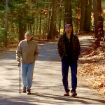 Carl & Darrel walking near the lake house.